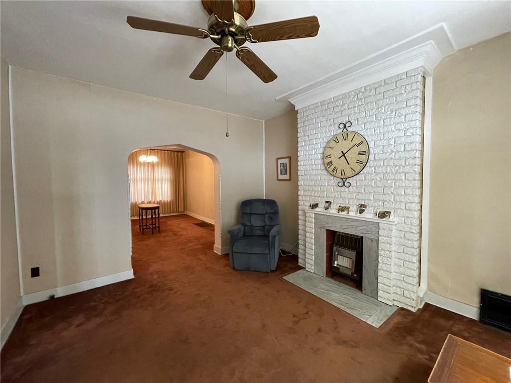 2209 Hawthorne Avenue Pittsburgh, PA 15218 - Photo 6 of 21 a living room with furniture and a fireplace