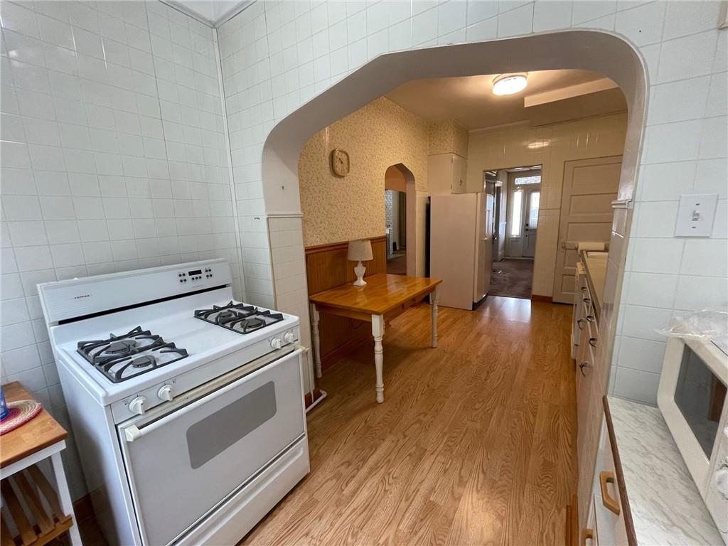 2209 Hawthorne Avenue Pittsburgh, PA 15218 - Photo 9 of 21 a view of kitchen with furniture and wooden floor