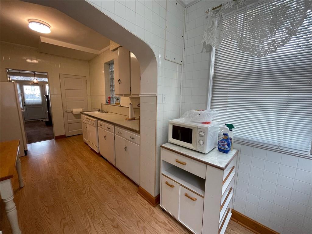 2209 Hawthorne Avenue Pittsburgh, PA 15218 - Photo 10 of 21 a kitchen with stainless steel appliances a stove top oven