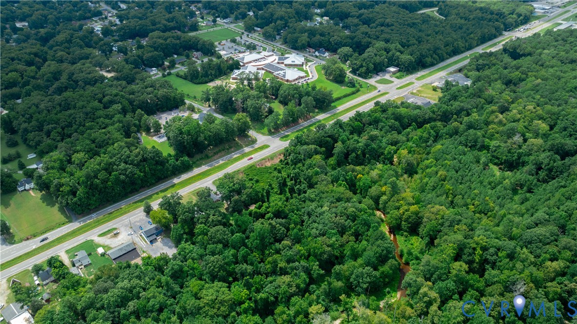 2100 East Hundred Road Chester, VA 23836 - Photo 6 of 8 an aerial view of residential houses with outdoor space and trees