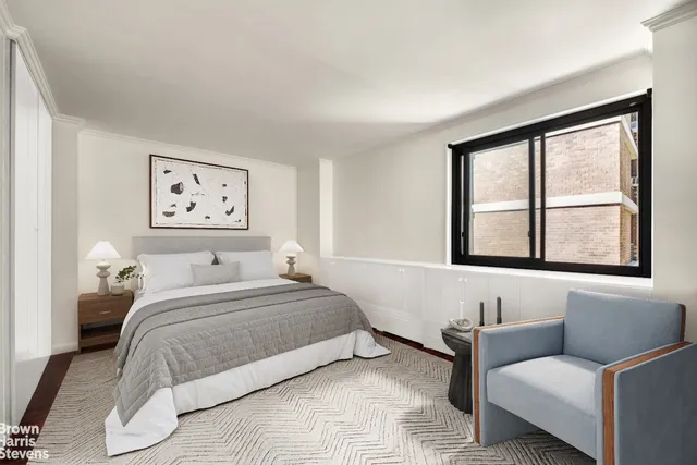 a bedroom with a bed and a couch