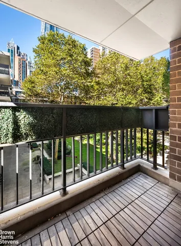 a view of balcony with wooden floor