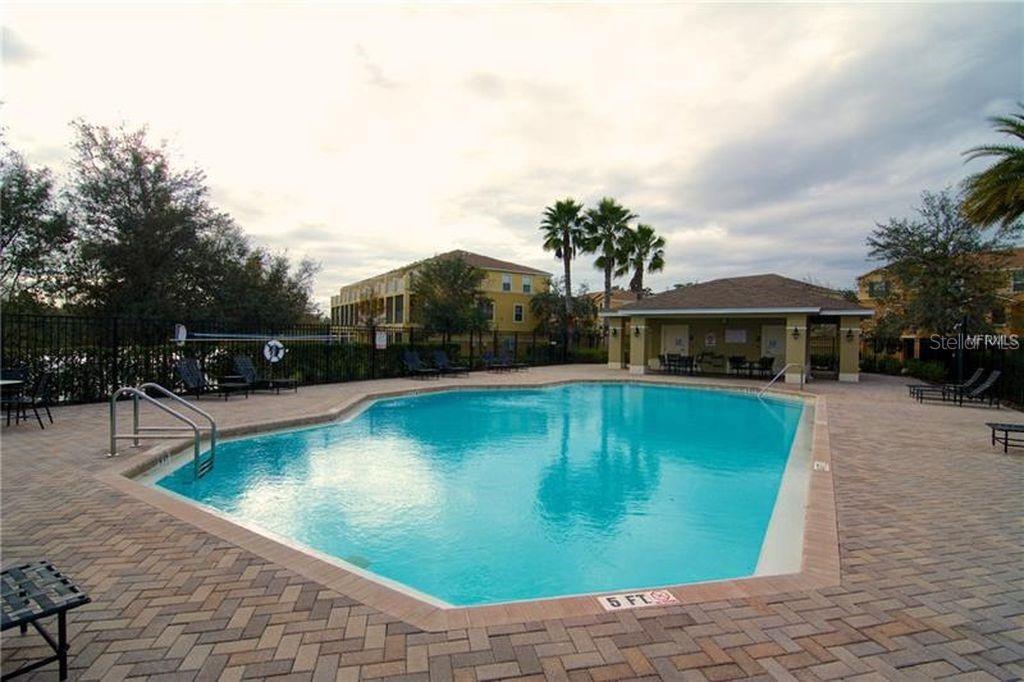 8946 White Sage Loop Lakewood Ranch, FL 34202 - Photo 34 of 36 a view of a swimming pool with a lounge chairs