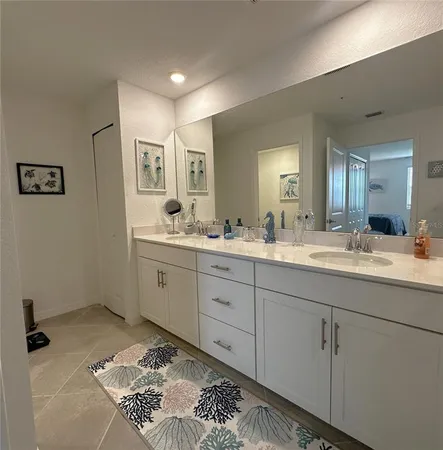 a spacious bathroom with a double vanity sink mirror and