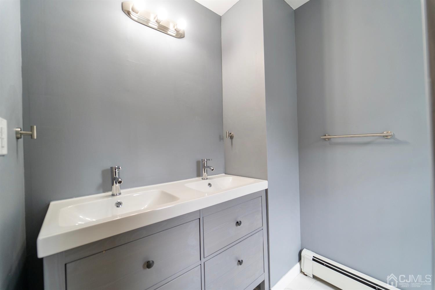 15 Middlesex Avenue Old Bridge, NJ 07735 - Photo 16 of 30 a bathroom with a sink and a mirror