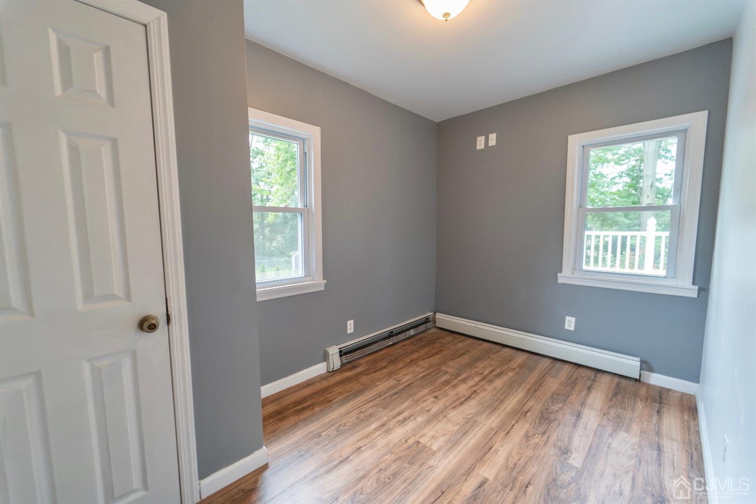 15 Middlesex Avenue Old Bridge, NJ 07735 - Photo 17 of 30 a view of a room with wooden floor and windows