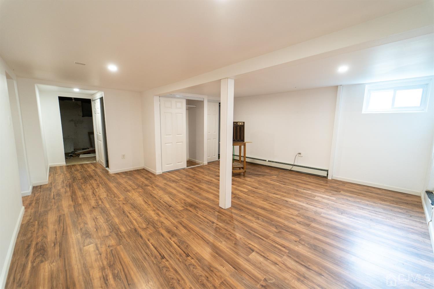 15 Middlesex Avenue Old Bridge, NJ 07735 - Photo 23 of 30 a view of empty room with wooden floor