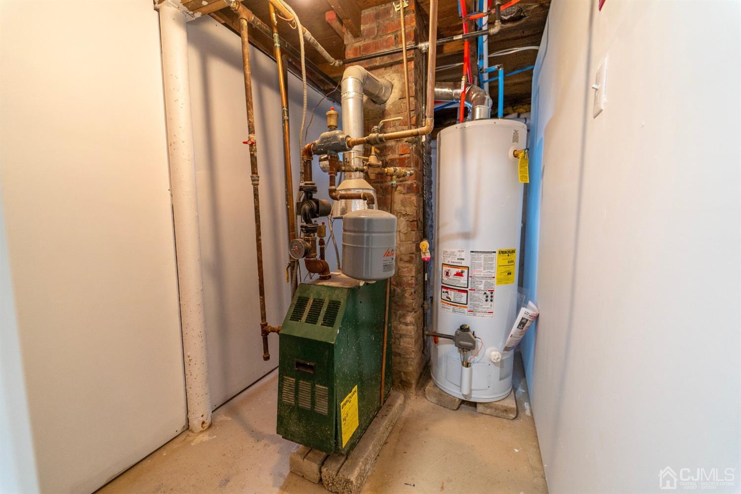 15 Middlesex Avenue Old Bridge, NJ 07735 - Photo 24 of 30 a room with water heater and storage