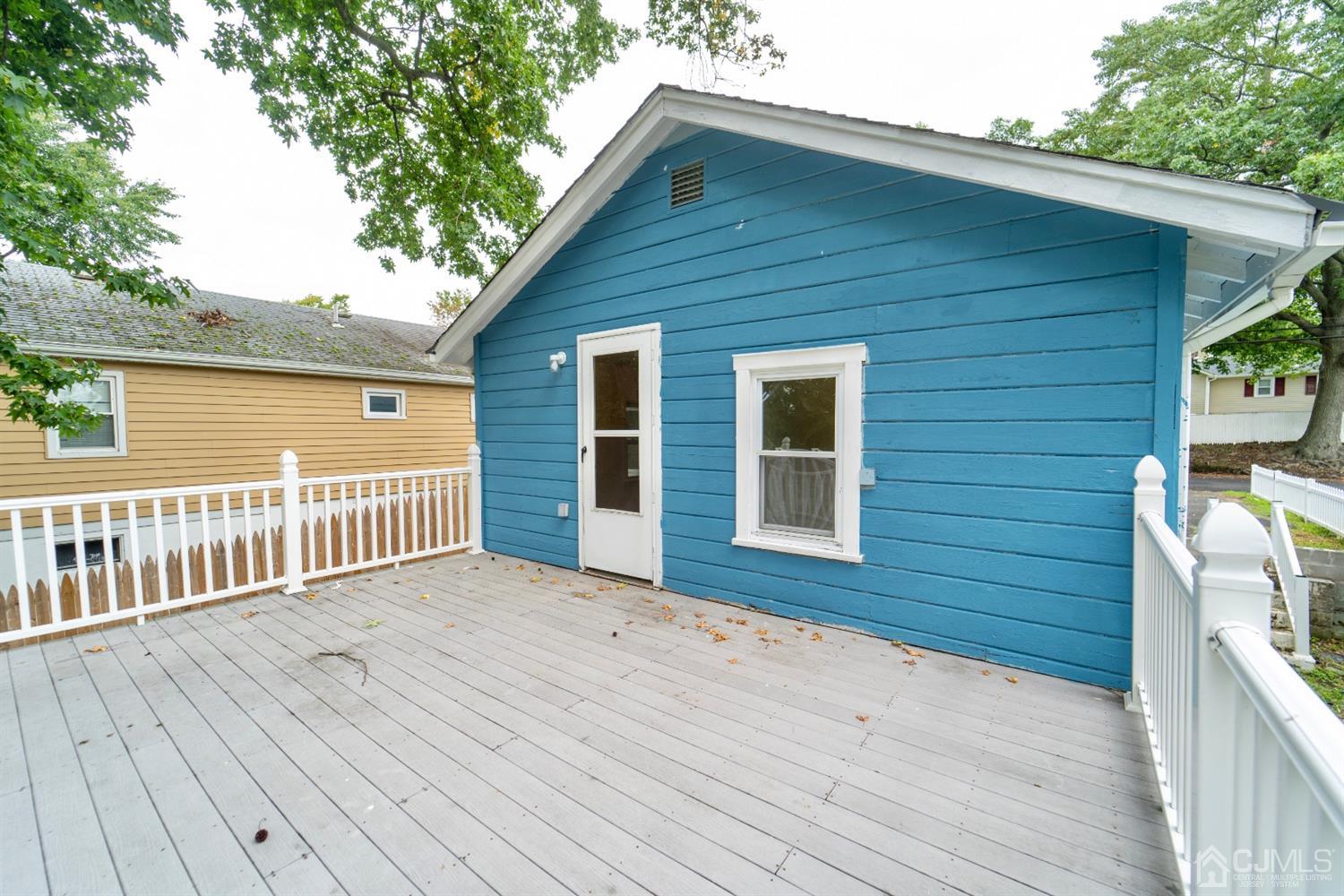 15 Middlesex Avenue Old Bridge, NJ 07735 - Photo 25 of 30 a view of backyard with a deck and wooden floor