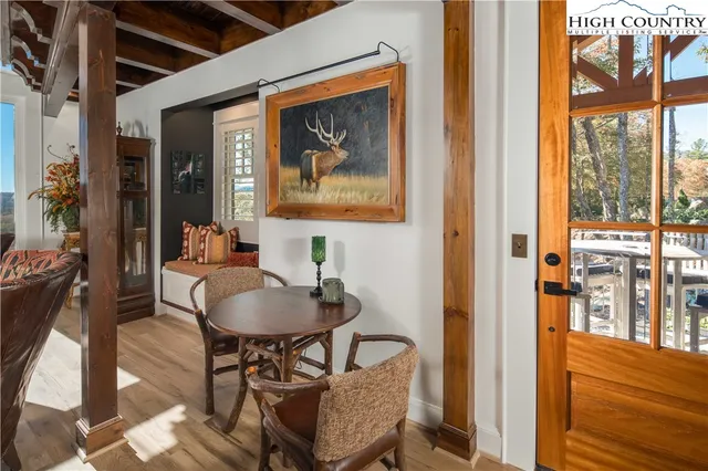 a dining room with furniture and wooden floor