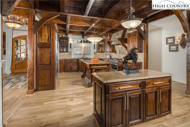 a kitchen with a stove and a refrigerator