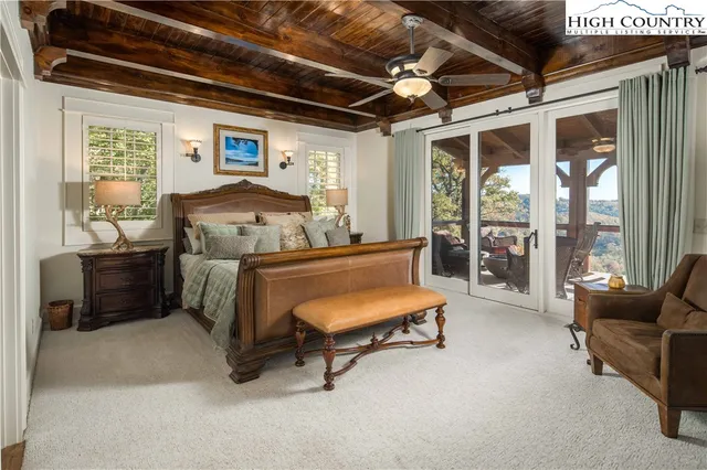 a bedroom with furniture and a window