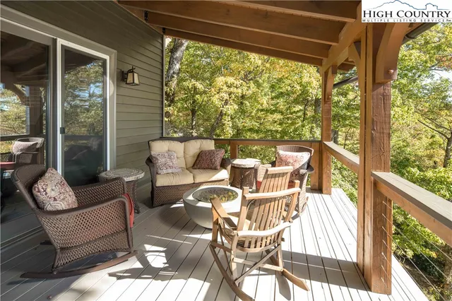 a view of a chairs and table in the balcony