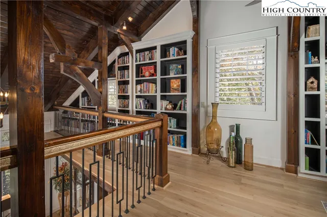 a view of entryway with wooden floor and stairs