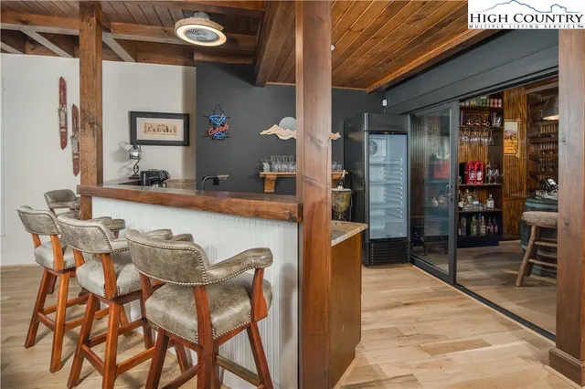 a dining room with furniture and chandelier