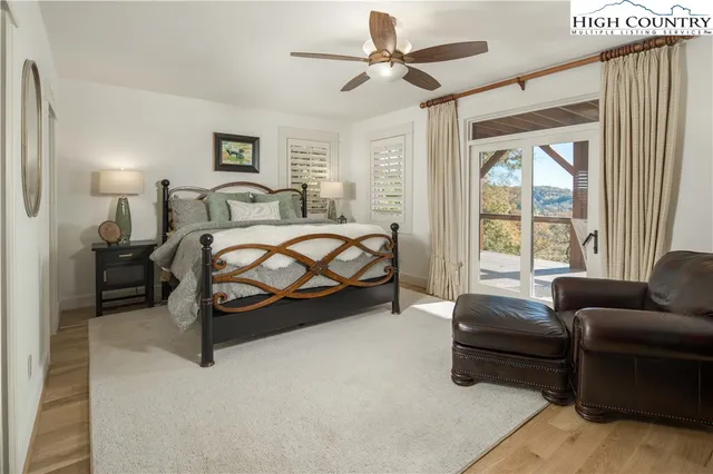 a bedroom with bed couch and window