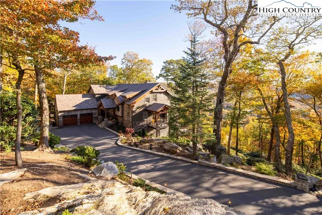 a view of a patio with table and chairs under an umbrella
