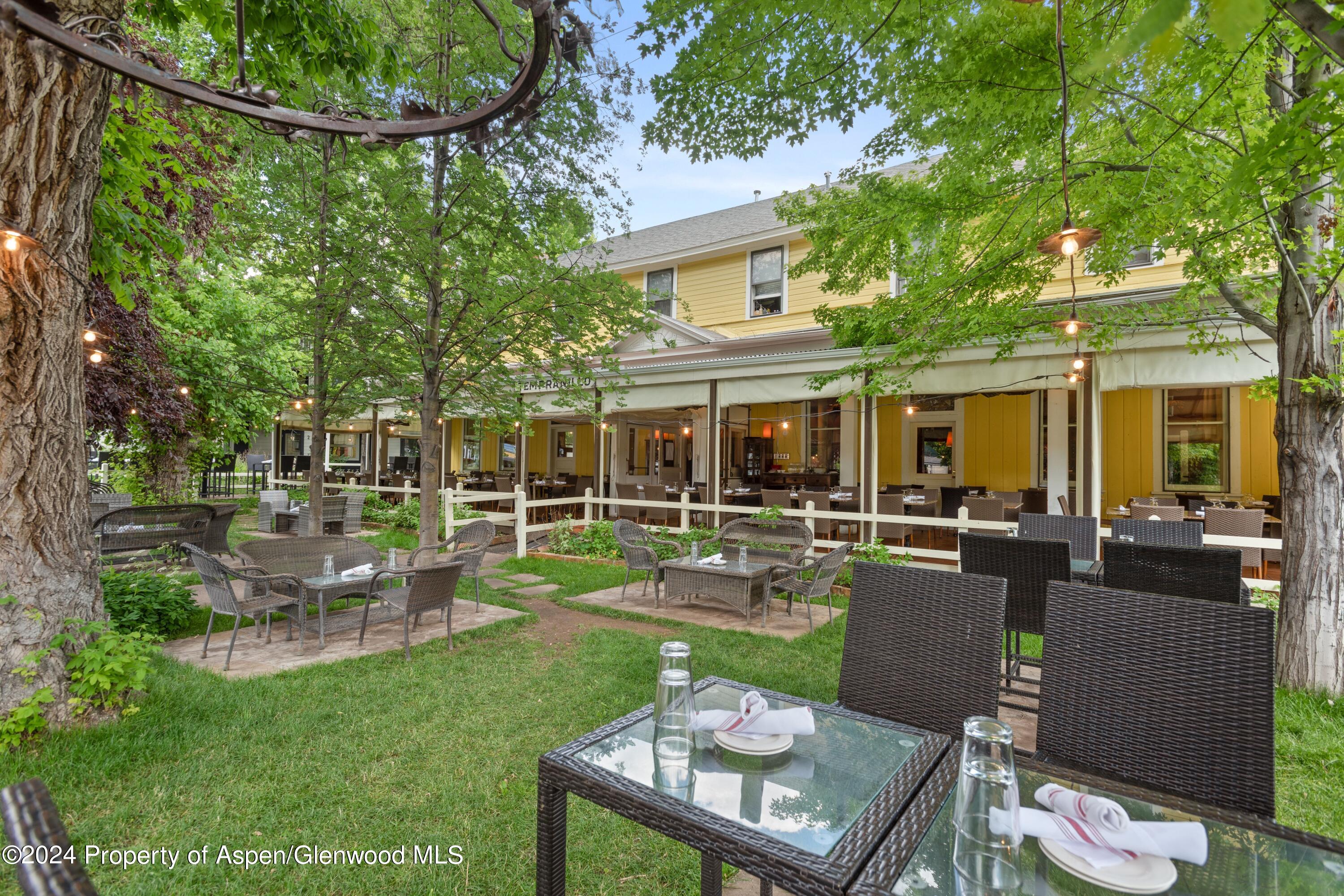 165 Midland Avenue Basalt, CO 81621 - Photo 3 of 9 a view of a house with backyard sitting area and garden