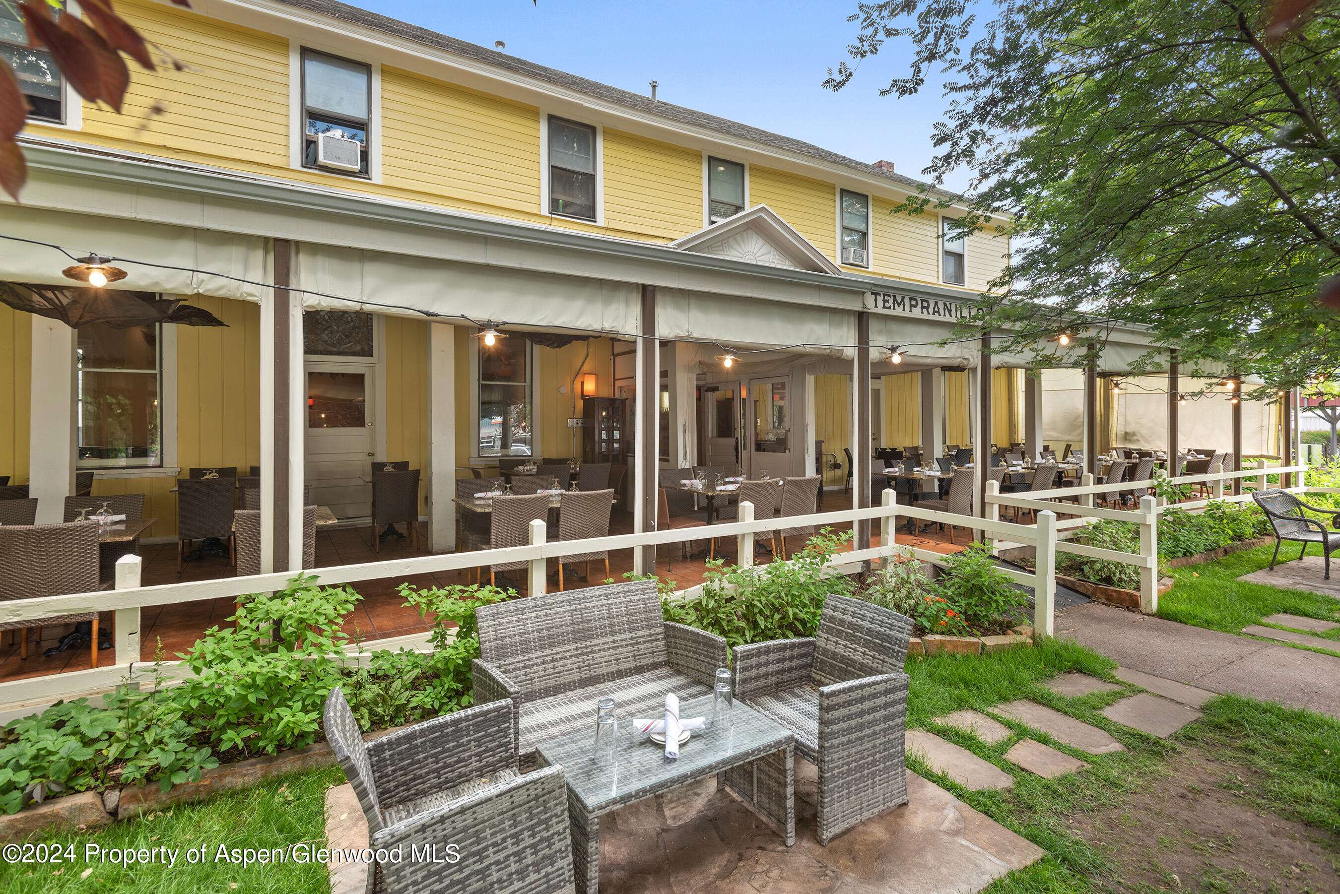 165 Midland Avenue Basalt, CO 81621 - Photo 5 of 9 a view of a chair and tables in patio of the house