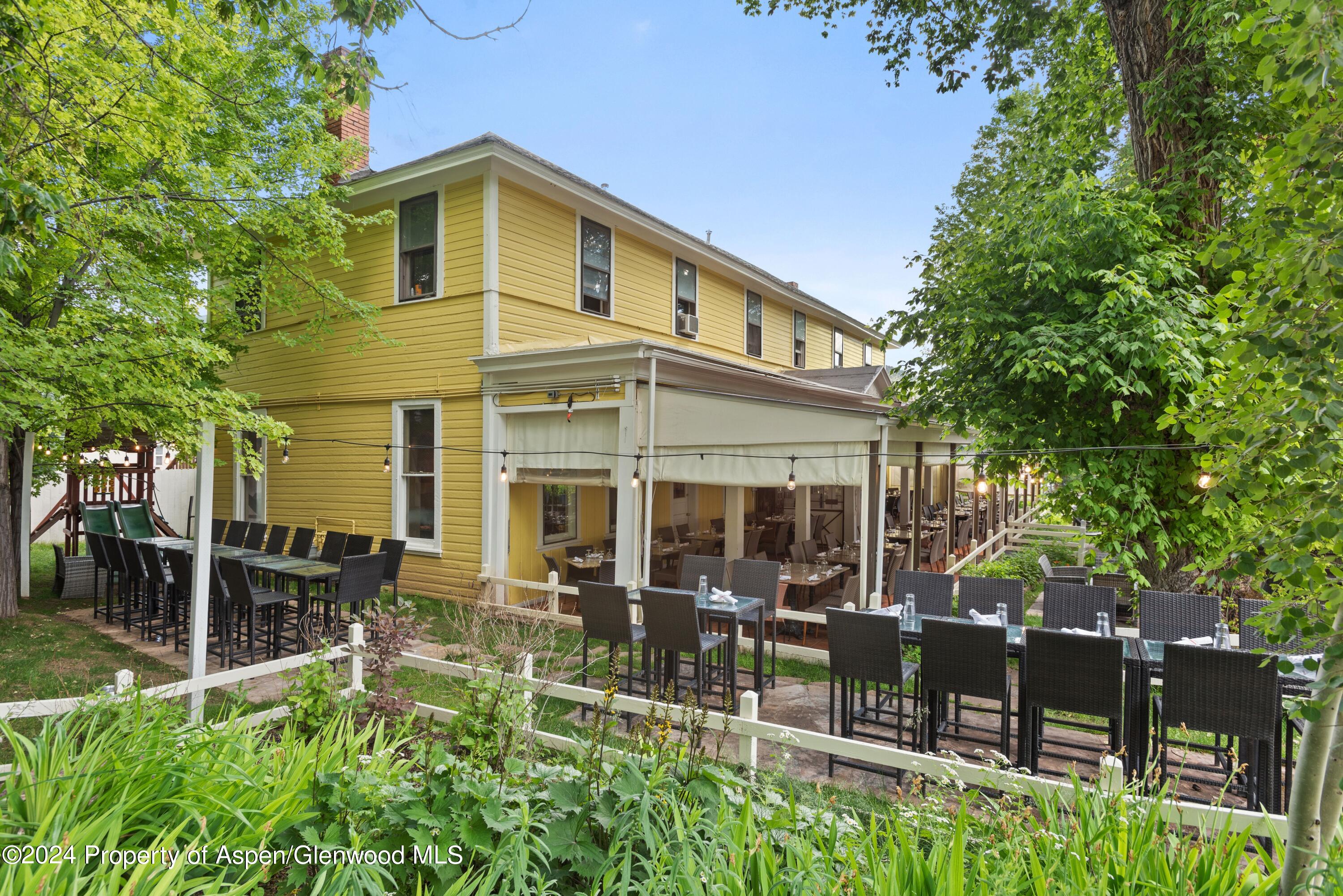 165 Midland Avenue Basalt, CO 81621 - Photo 6 of 9 a front view of a house with garden