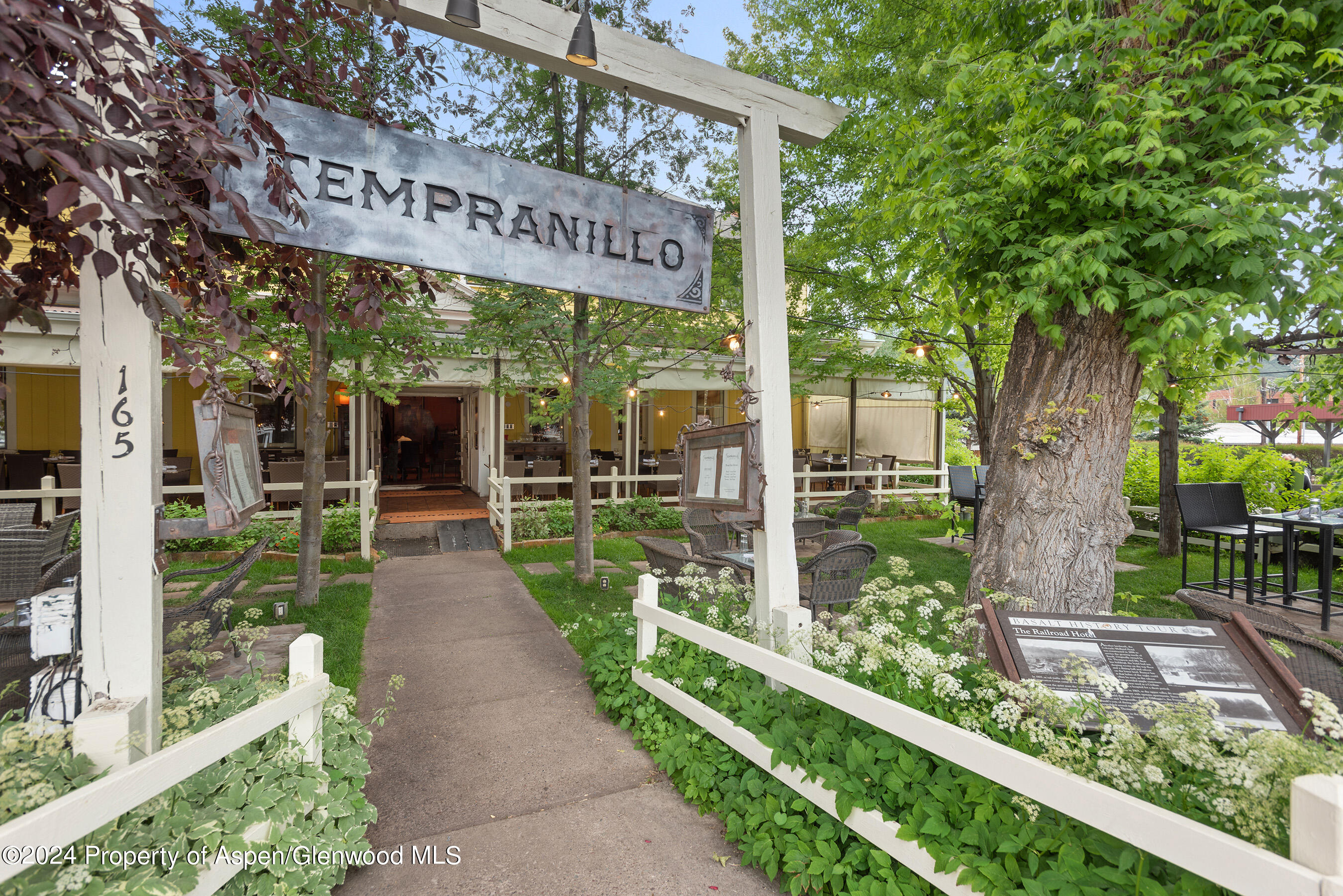 165 Midland Avenue Basalt, CO 81621 - Photo 7 of 9 a view of a park with potted plants and large tree
