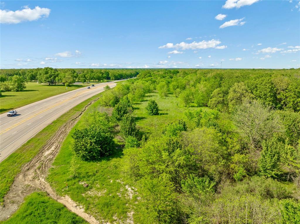 286 Northeast Loop 286 Paris, TX 75460 - Photo 7 of 17 a view of a yard and an trees