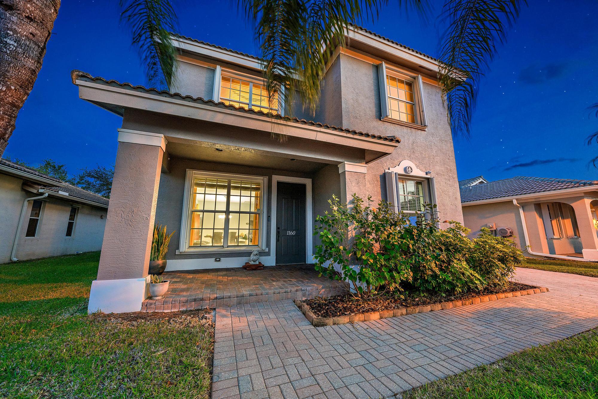 1160 Southeast Kirk Street Stuart, FL 34997 - Photo 2 of 42 Front Exterior Twilight jpg