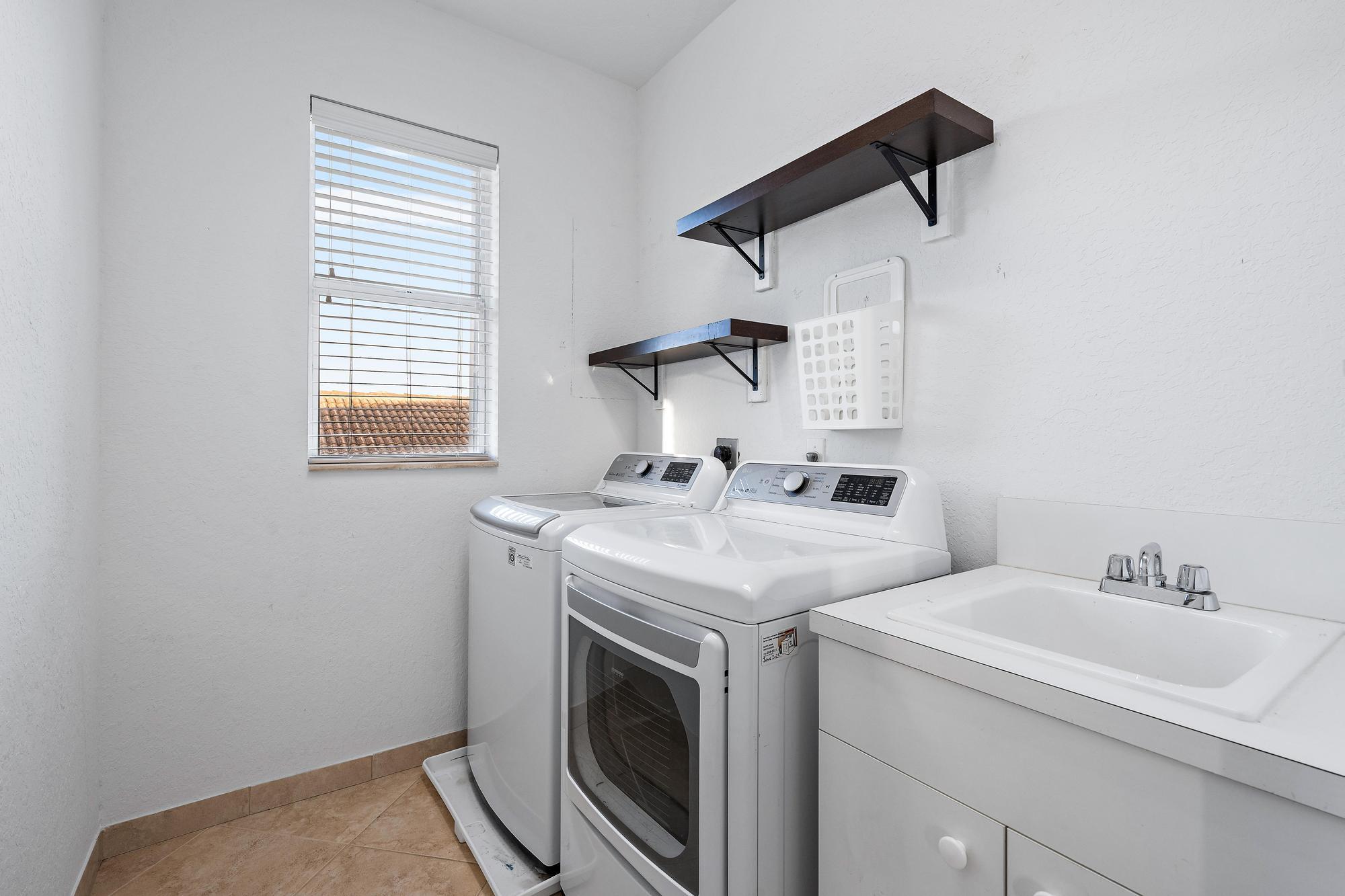1160 Southeast Kirk Street Stuart, FL 34997 - Photo 25 of 42 Laundry Room