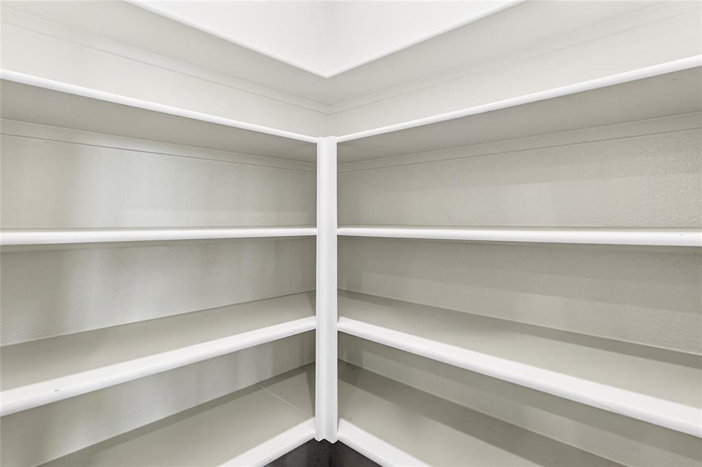656 Waymaker Way Princeton, TX 75407 - Photo 21 of 40 Corner pantry featuring multiple white shelves