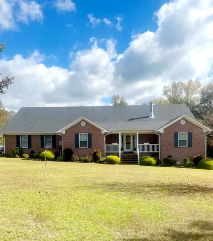 a front view of residential houses with yard and swimming pool