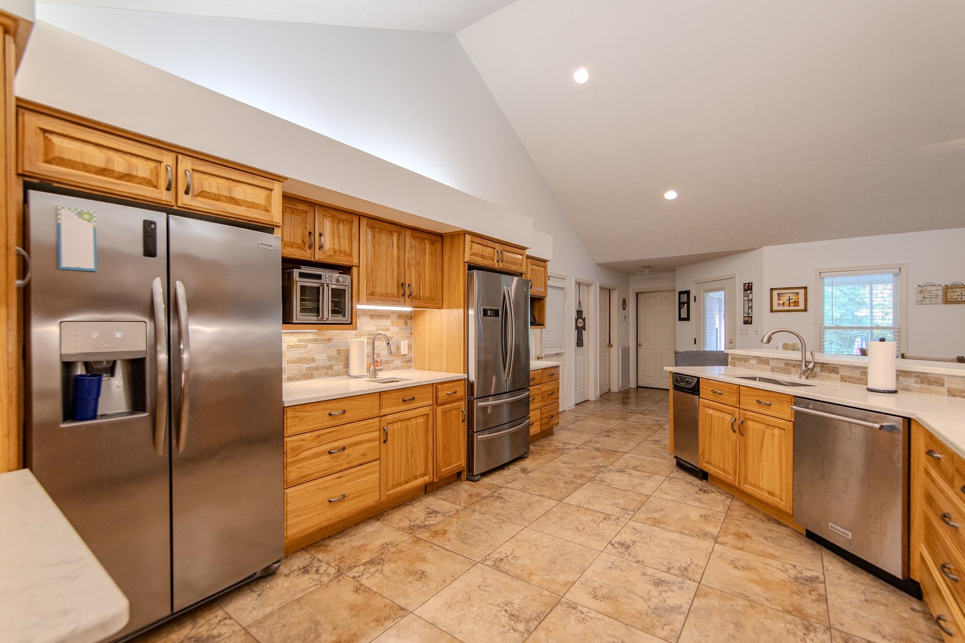 485 Robin Hood Loop Savannah, TN 38372 - Photo 13 of 40 a kitchen with stainless steel appliances granite countertop a refrigerator and a stove