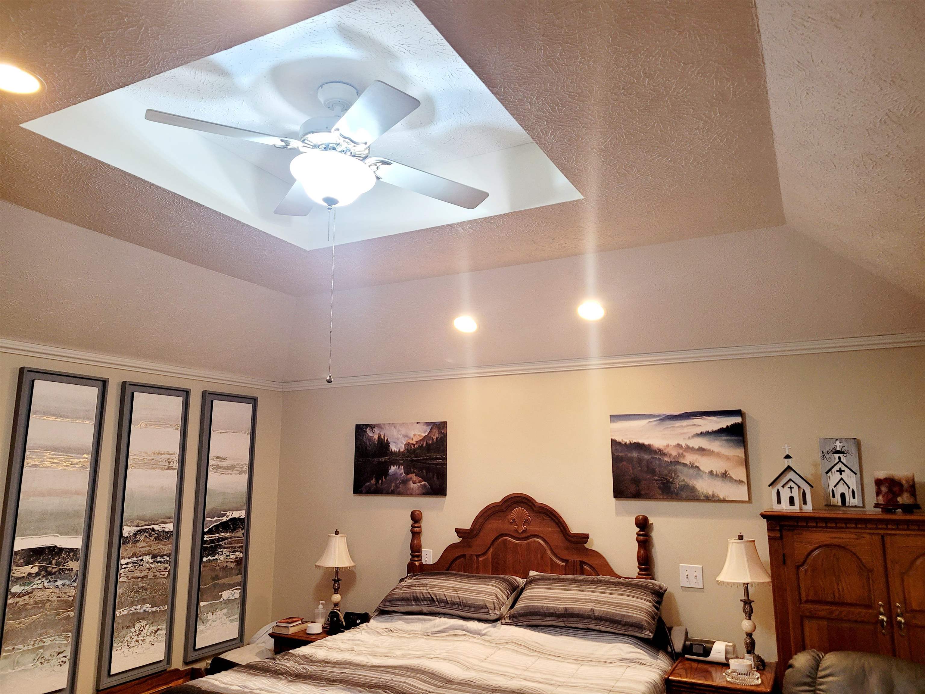 485 Robin Hood Loop Savannah, TN 38372 - Photo 22 of 40 a bedroom with furniture and a flat screen tv