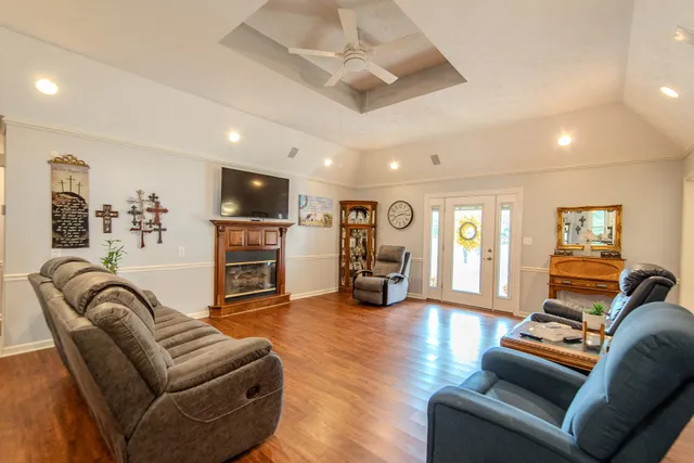 a living room with furniture or couch and a flat screen tv