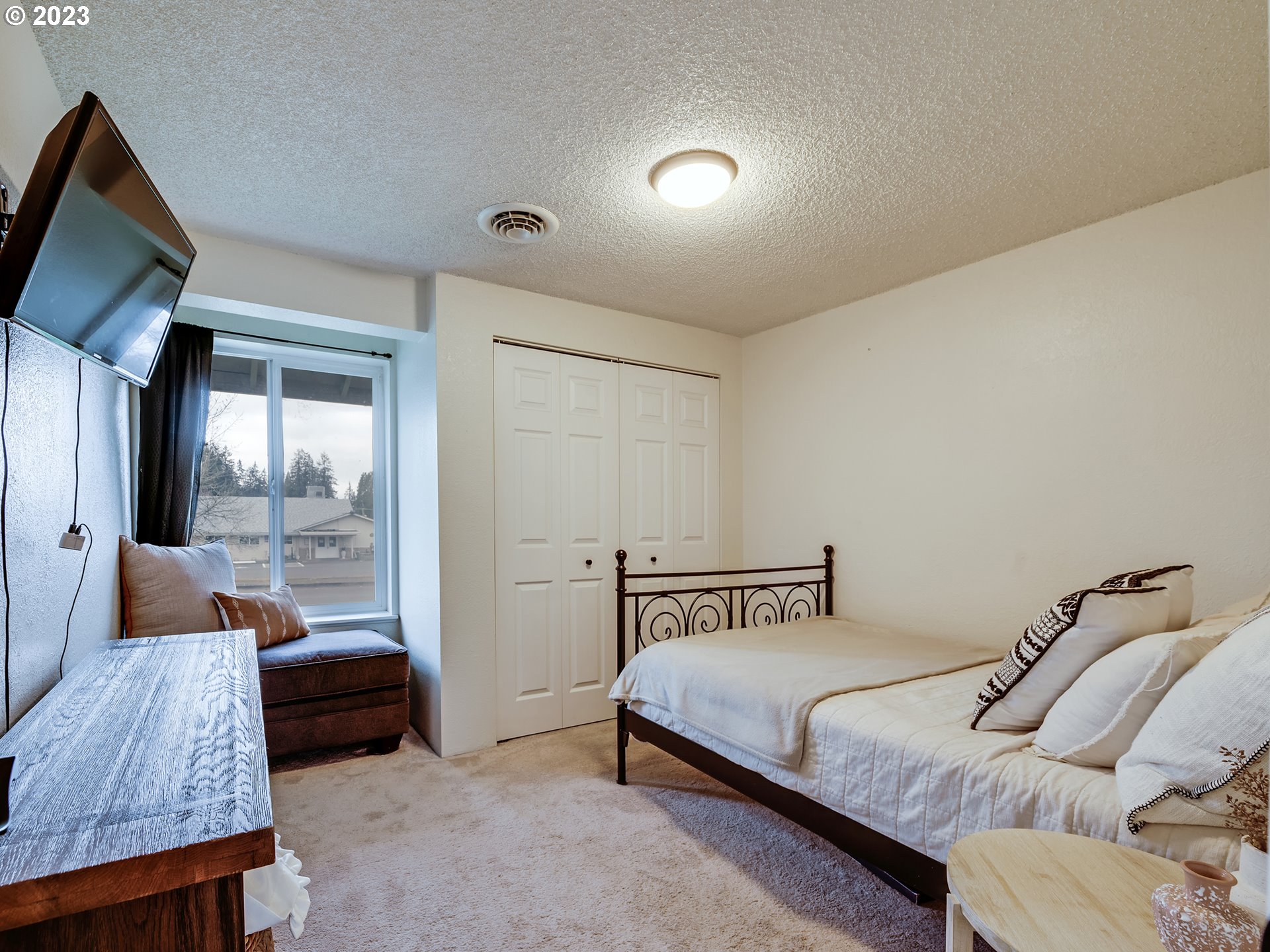 277 South 70th Place Springfield, OR 97478 - Photo 16 of 26 a bedroom with a bed and walk in closet
