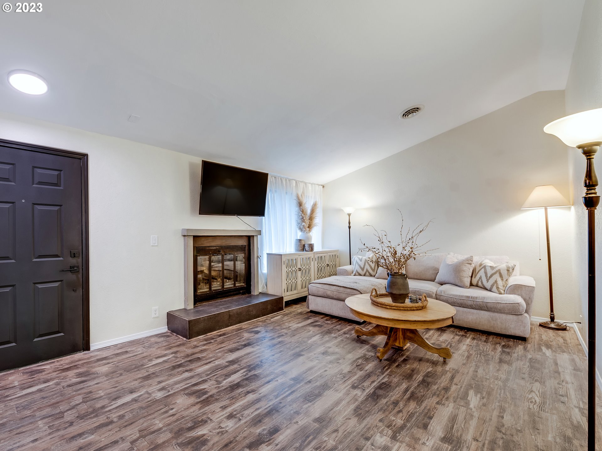 277 South 70th Place Springfield, OR 97478 - Photo 2 of 26 a living room with furniture and a fireplace