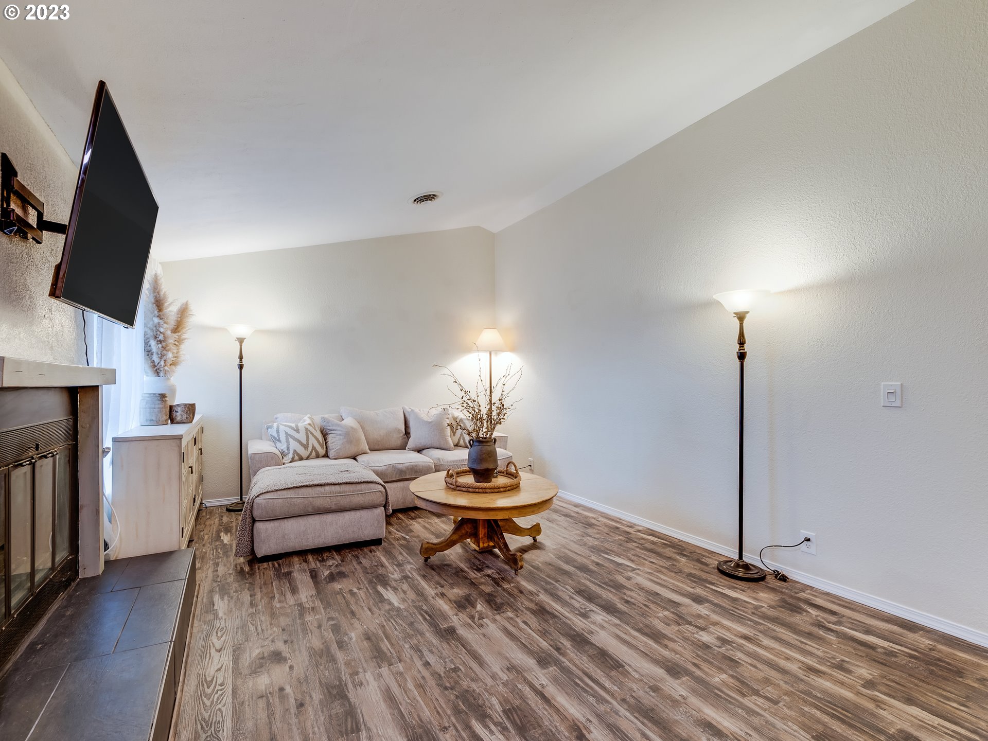277 South 70th Place Springfield, OR 97478 - Photo 5 of 26 a living room with furniture and a fireplace