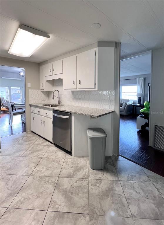 1100 South Belcher Road, Unit 772 Largo, FL 33771 - Photo 21 of 84 a kitchen with stainless steel appliances granite countertop a stove a sink a counter space and cabinets