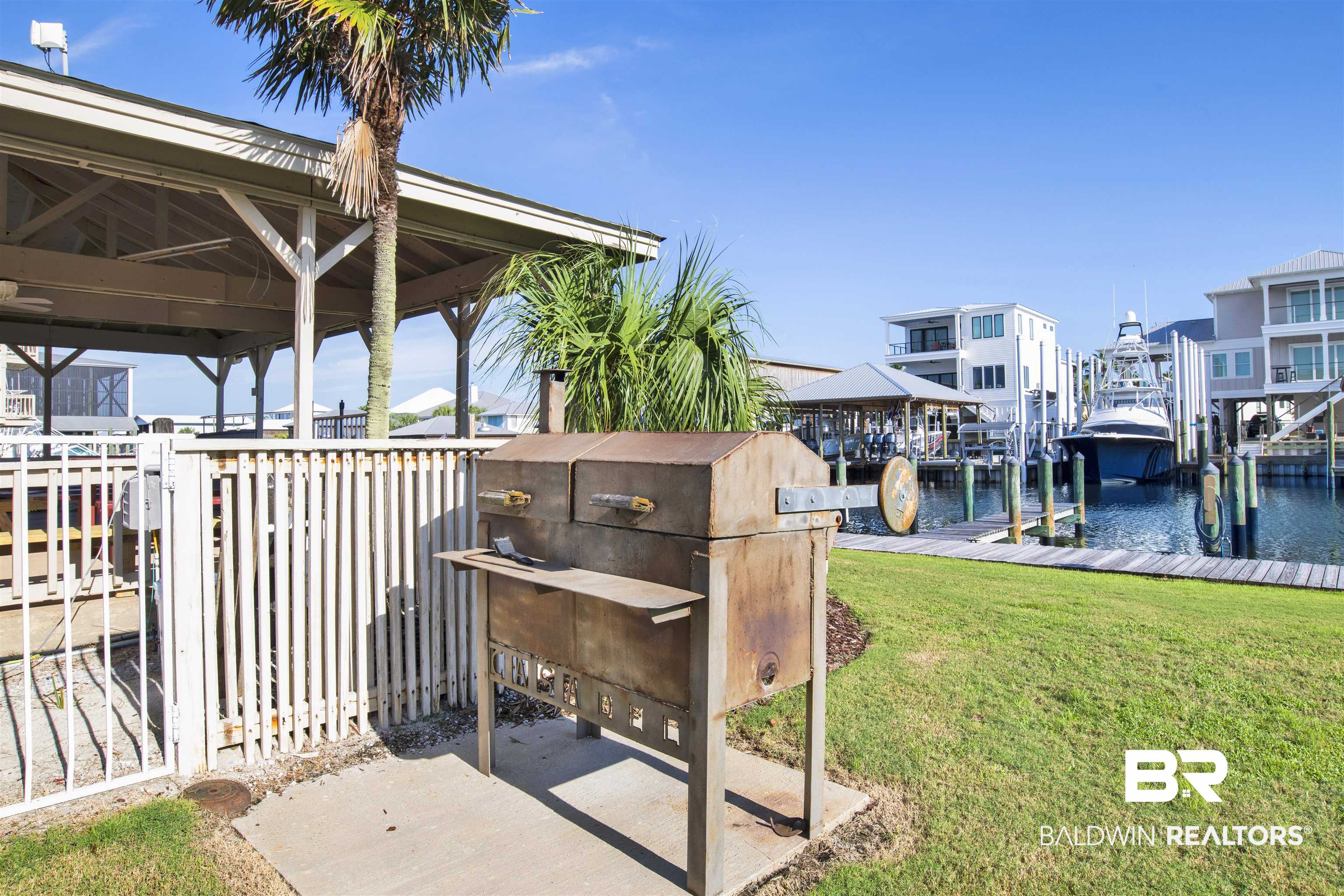 26913 Marina Road, Unit 213 Orange Beach, AL 36561 - Photo 27 of 30 Exterior space featuring a yard and a water view