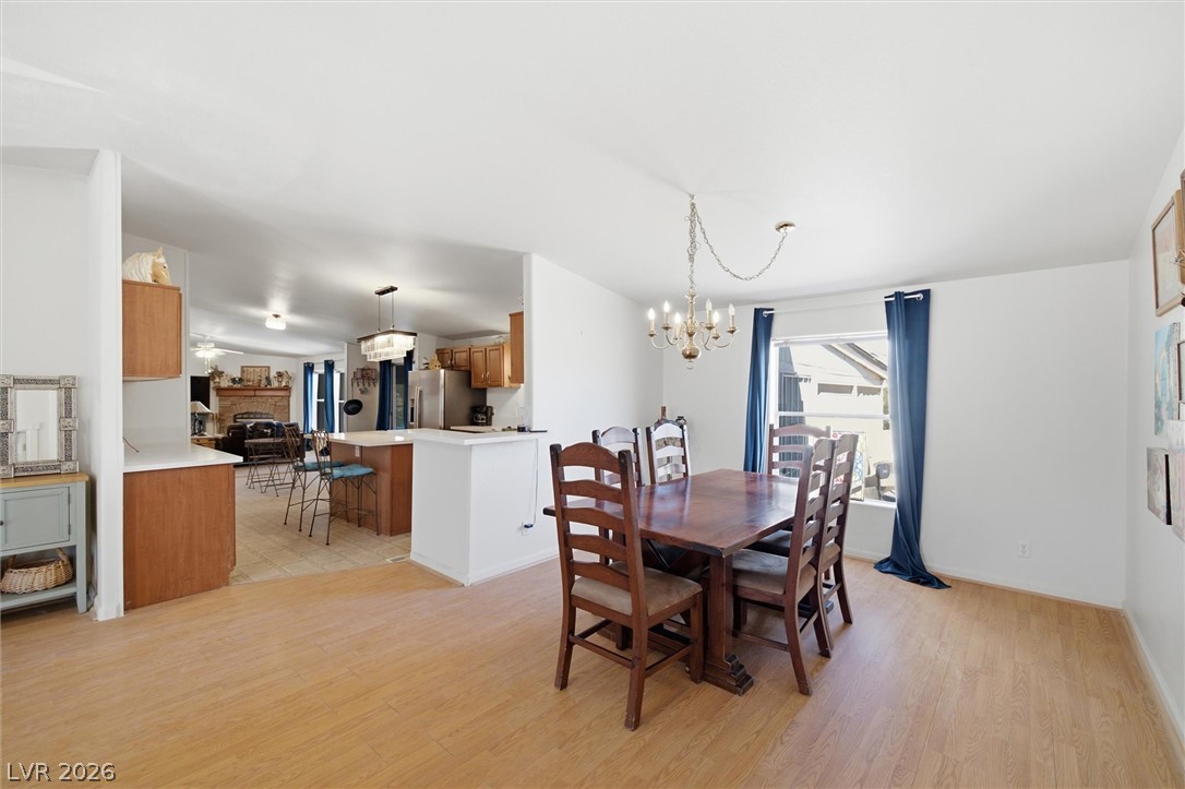 2380 West Simkins Road Pahrump, NV 89060 - Photo 9 of 38 An open dining area links seamlessly to the kitchen and boasts laminate flooring throughout.