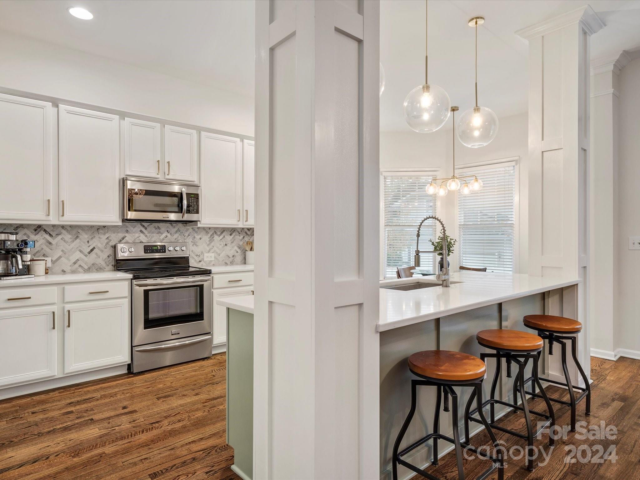 432 Third Baxter Street Fort Mill, SC 29708 - Photo 21 of 48 a kitchen with stainless steel appliances a stove a sink and a refrigerator