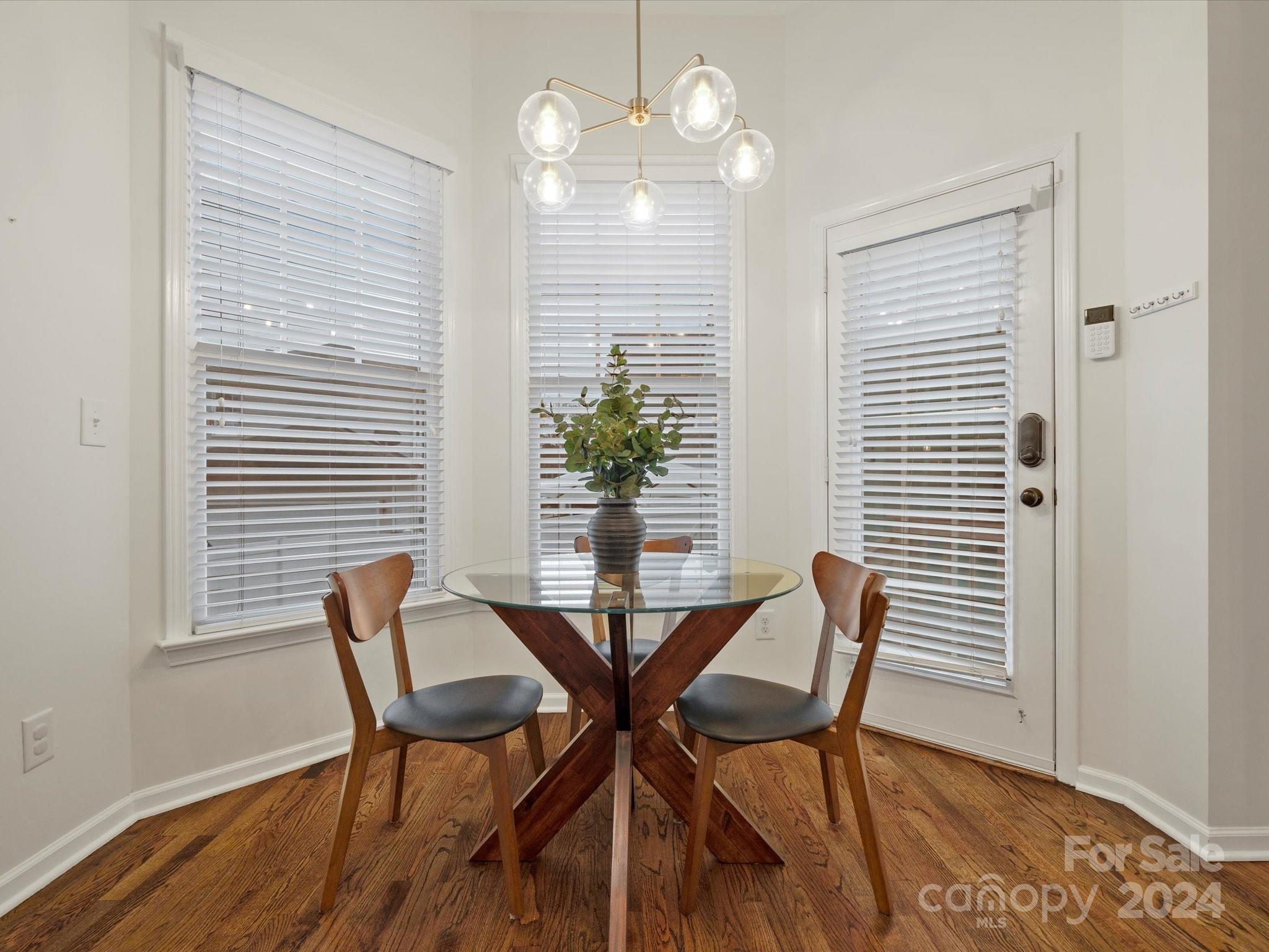432 Third Baxter Street Fort Mill, SC 29708 - Photo 28 of 48 a view of a dining room with furniture and wooden floor