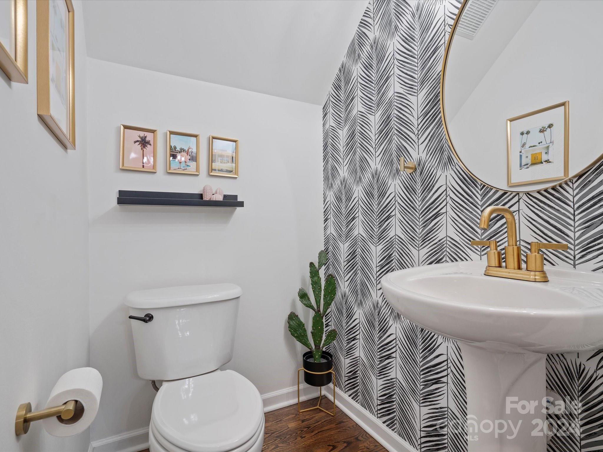 432 Third Baxter Street Fort Mill, SC 29708 - Photo 29 of 48 a white toilet sitting next to a bathroom sink