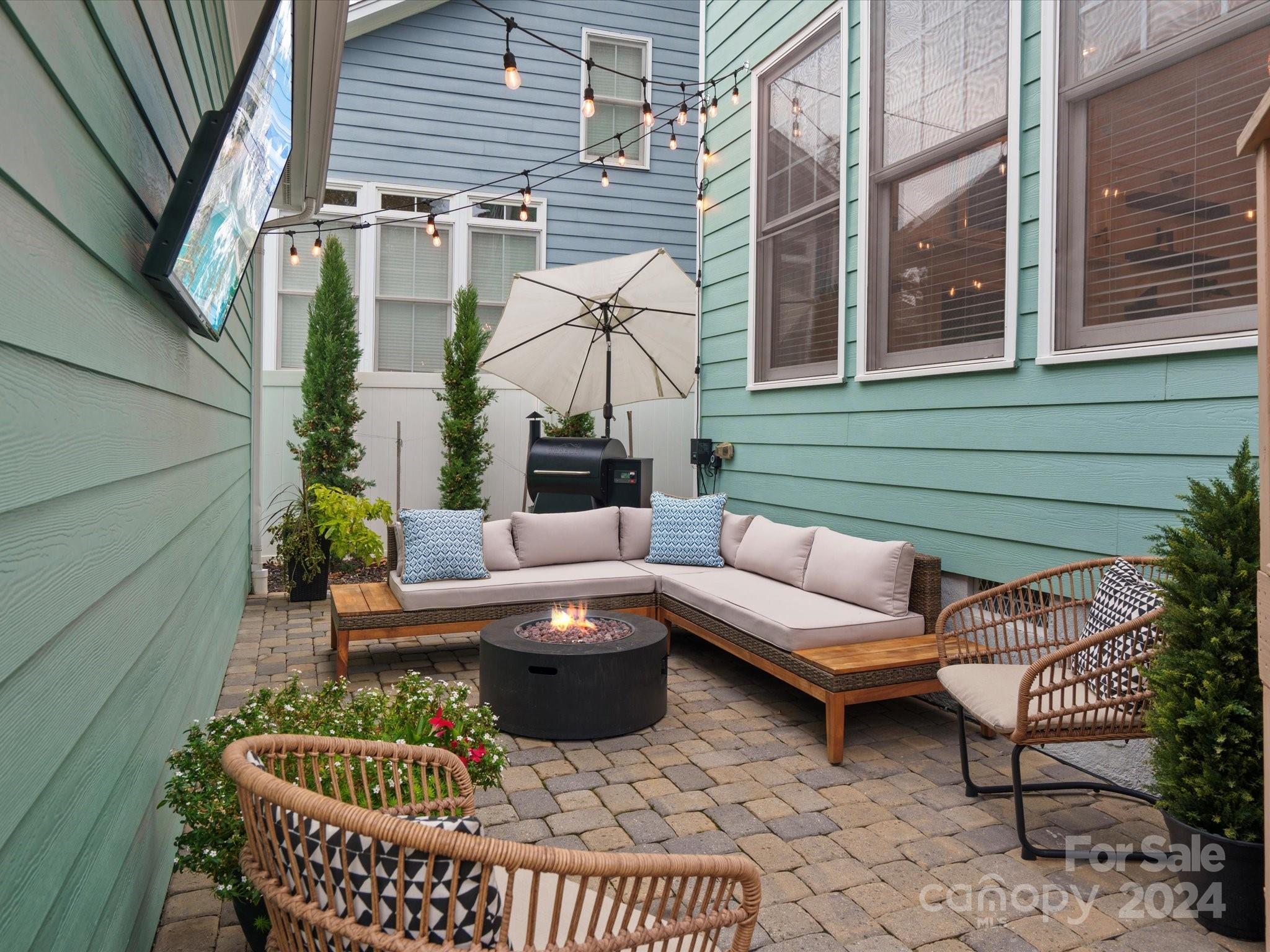 432 Third Baxter Street Fort Mill, SC 29708 - Photo 40 of 48 a view of patio with couches table and chairs and potted plants