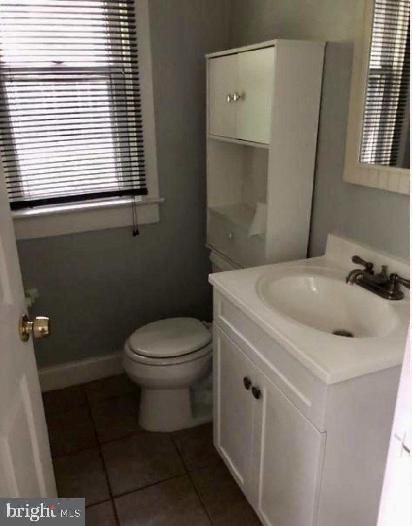 218 Chestnut Street Audubon, NJ 08106 - Photo 7 of 11 a bathroom with a sink toilet and window