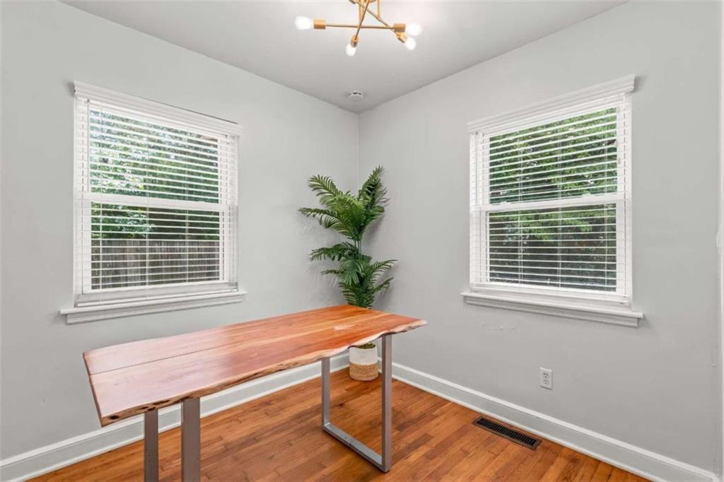 1780 John Calvin Avenue, Unit R College Park, GA 30337 - Photo 6 of 12 a room that has a window and a potted plant on table