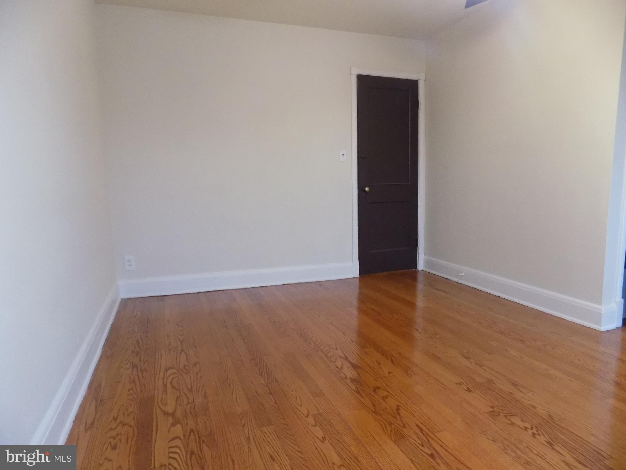 3925 Colborne Road Baltimore, MD 21229 - Photo 6 of 13 wooden floor in a empty room