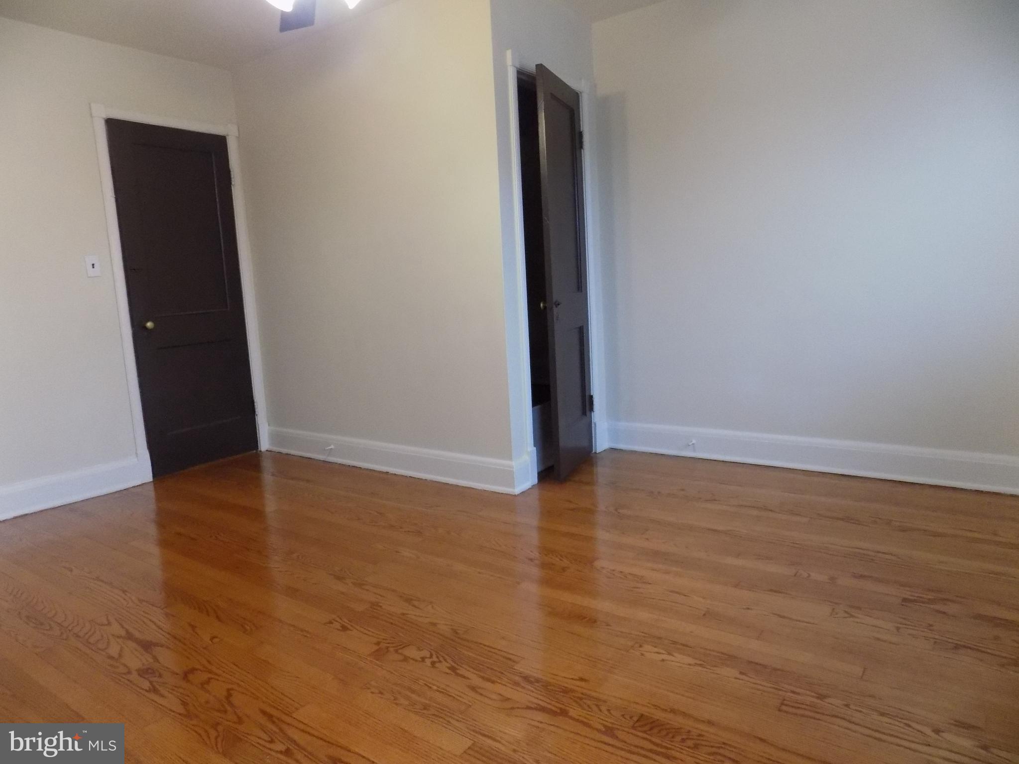 3925 Colborne Road Baltimore, MD 21229 - Photo 7 of 13 wooden floor in an empty room