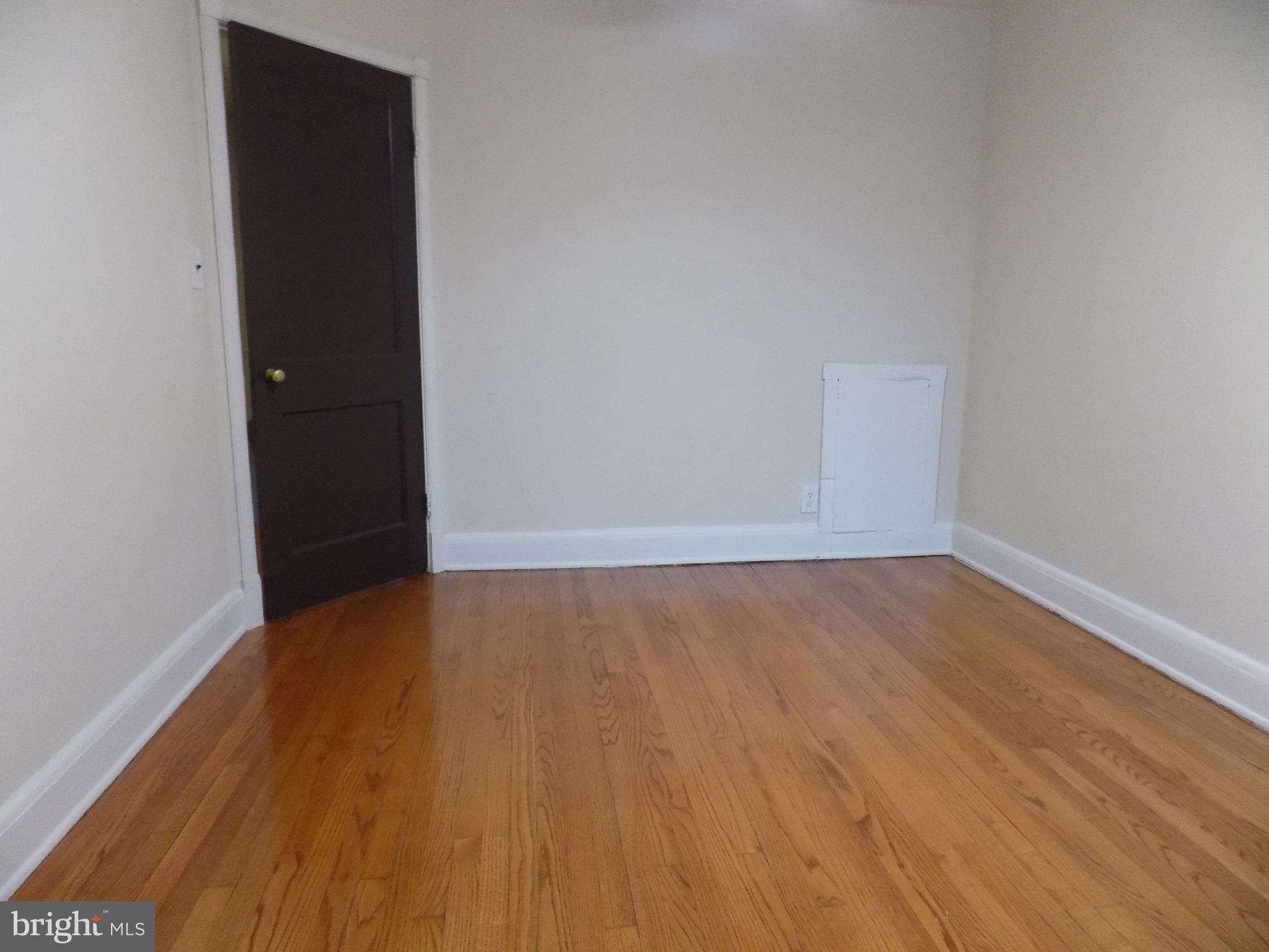 3925 Colborne Road Baltimore, MD 21229 - Photo 8 of 13 wooden floor in a empty room