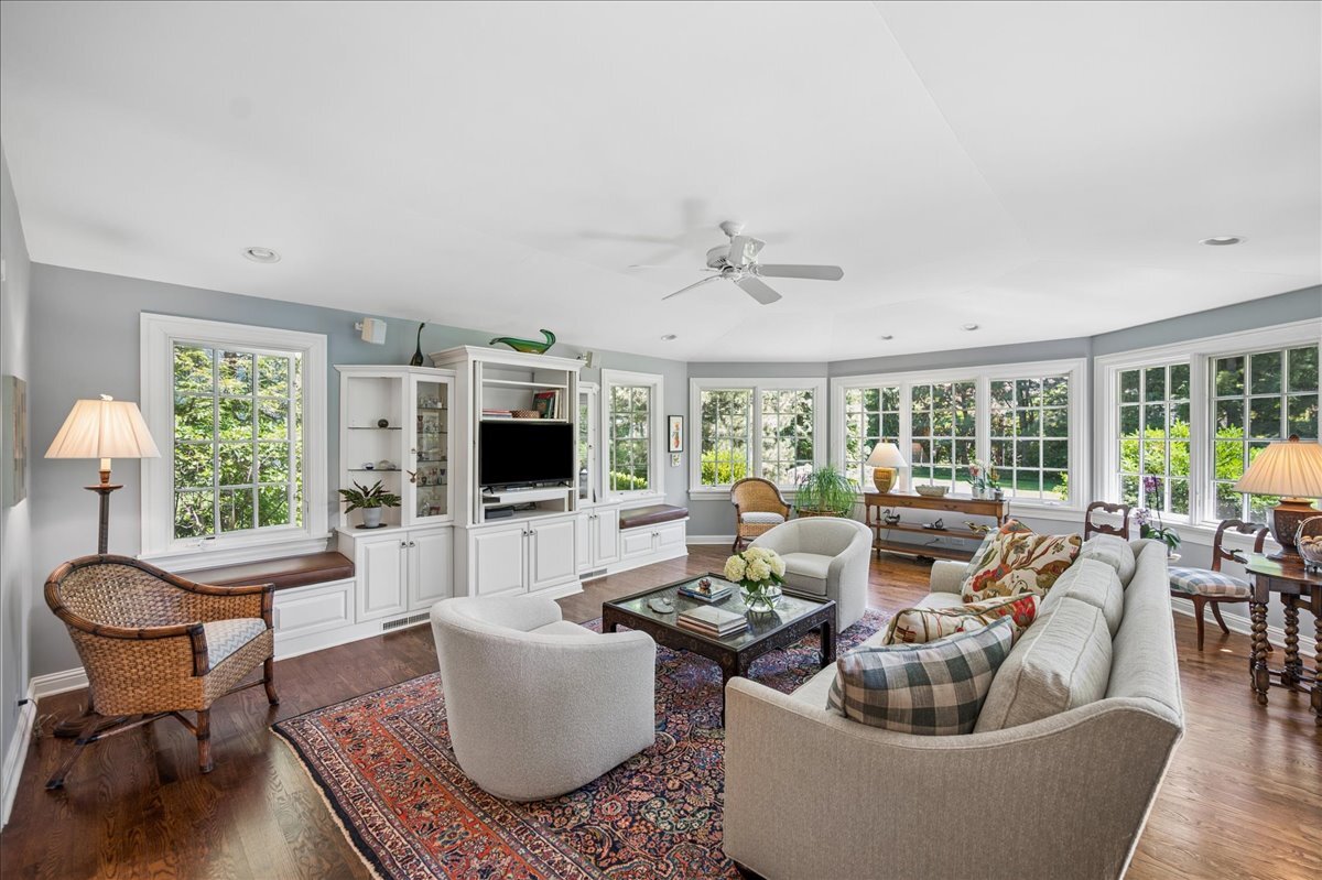 253 Summerfield Road Northbrook, IL 60062 - Photo 19 of 46 a living room with fireplace furniture and a large window