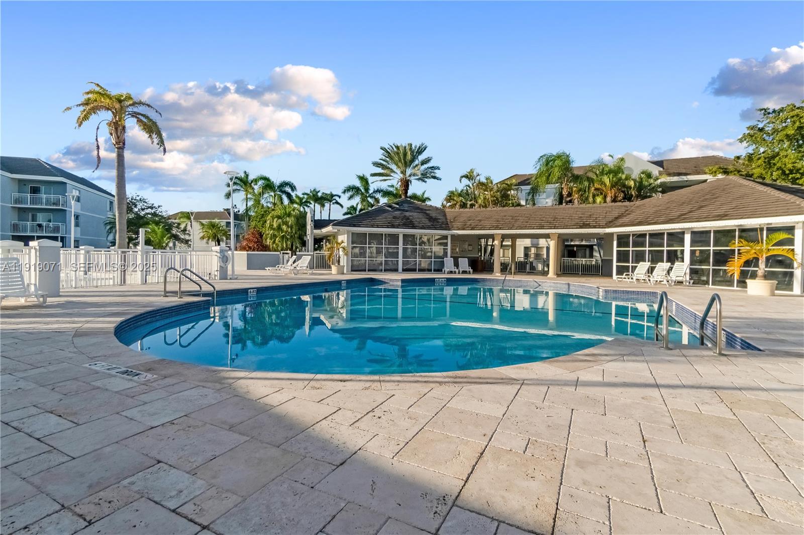 8560 Southwest 212th Street, Unit 308 Cutler Bay, FL 33189 - Photo 17 of 26 a view of a house with backyard and sitting area